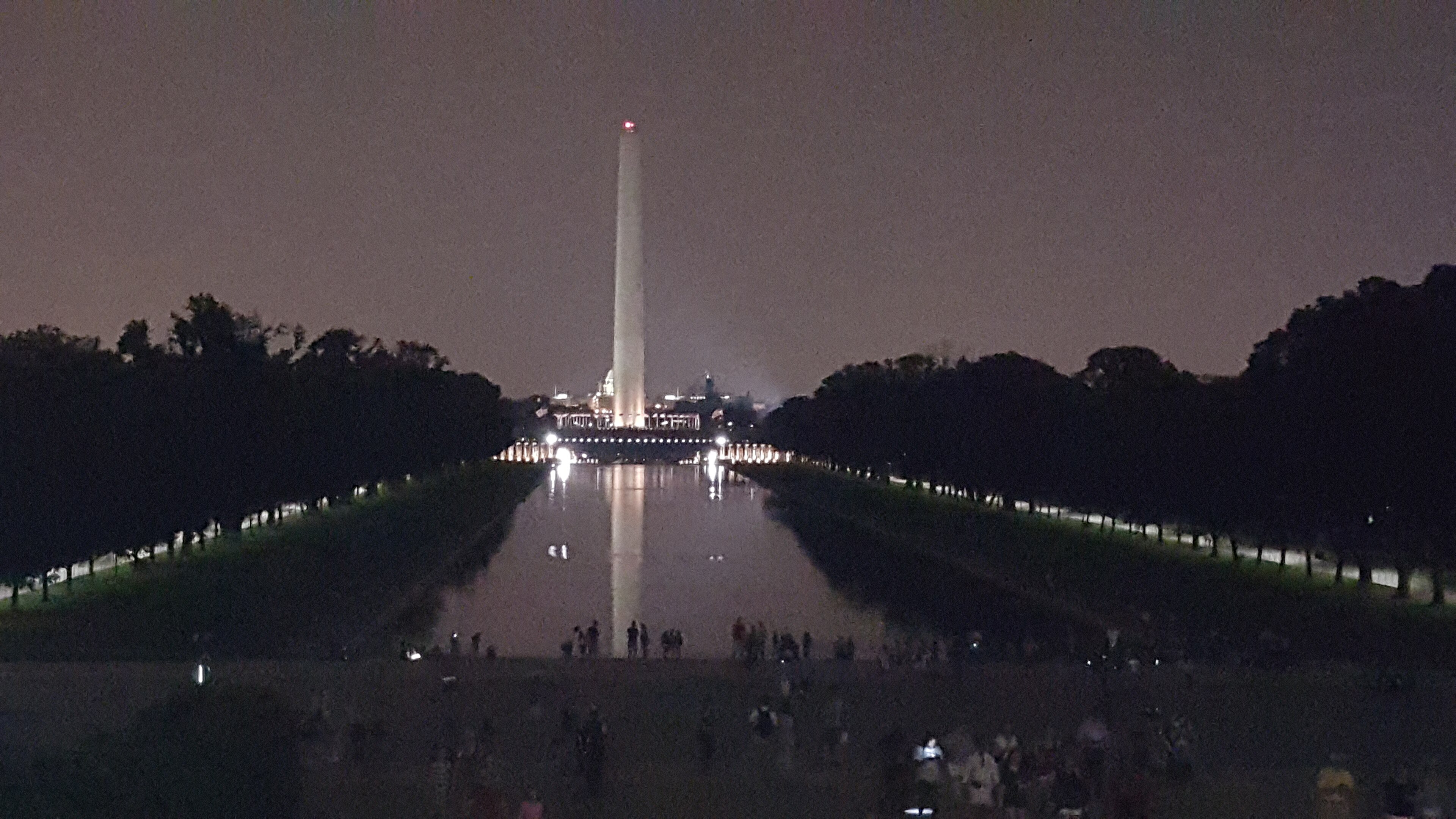 The Washington Monument reflected in the Lincoln Memorial Reflecting Pool at night